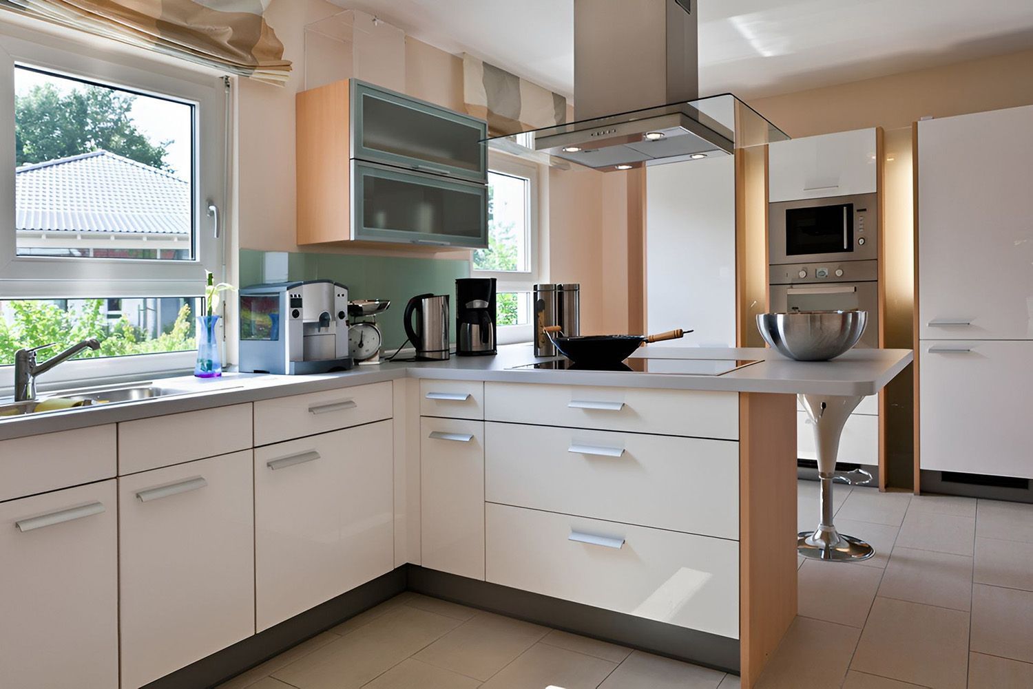 Modern White Kitchen With Stainless Steel Appliances