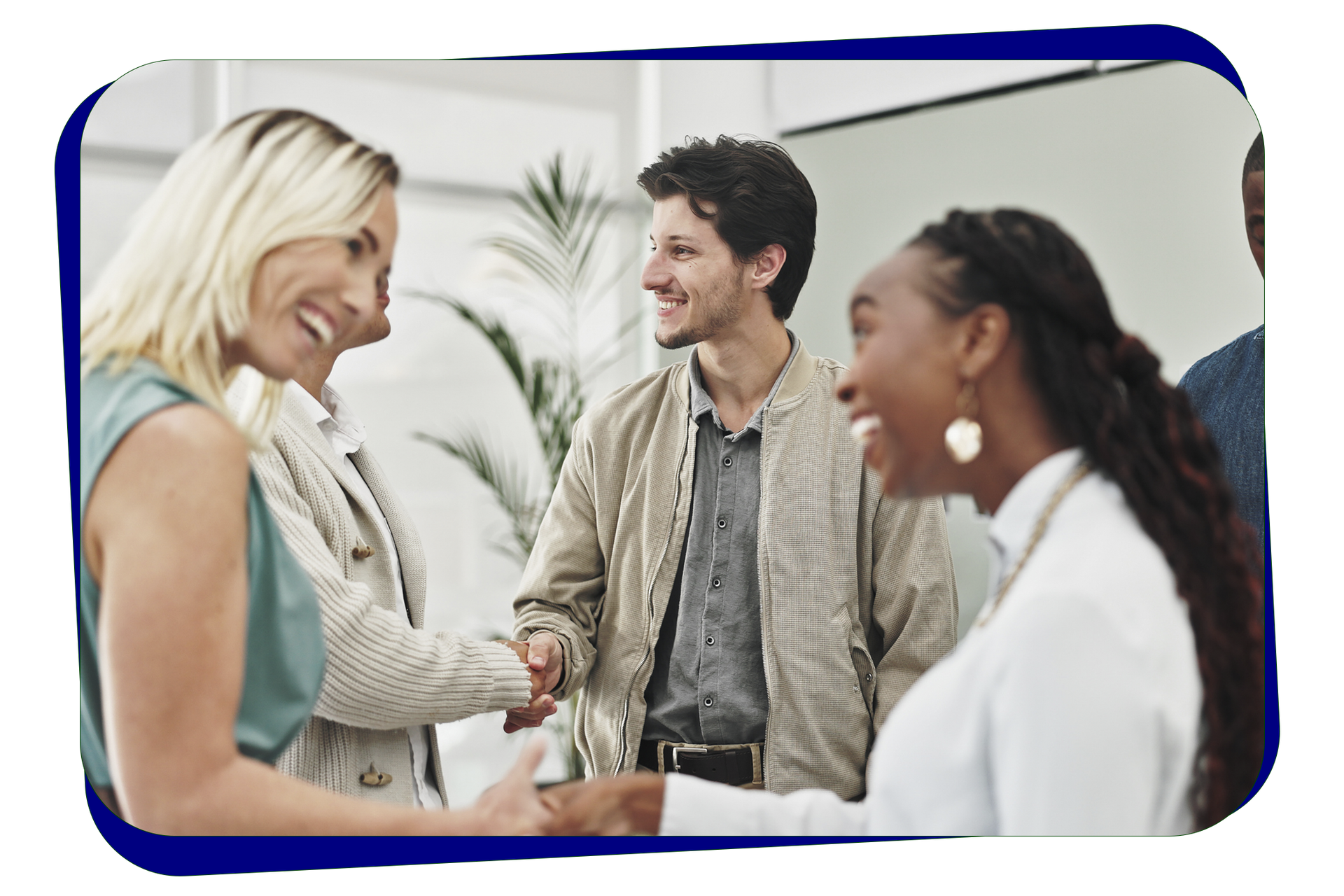 A group of people are shaking hands in a room A group of people are shaking hands in a room