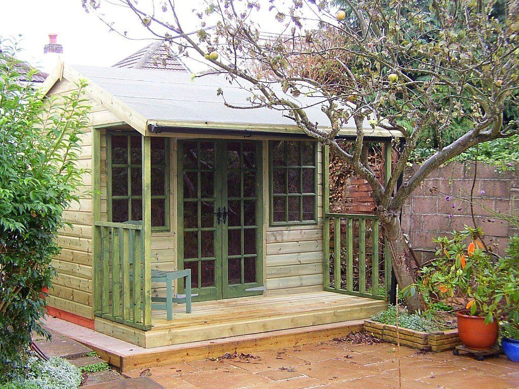 The Bridford Summer House by CP Sheds Devon with verandah and and painted doors and windows