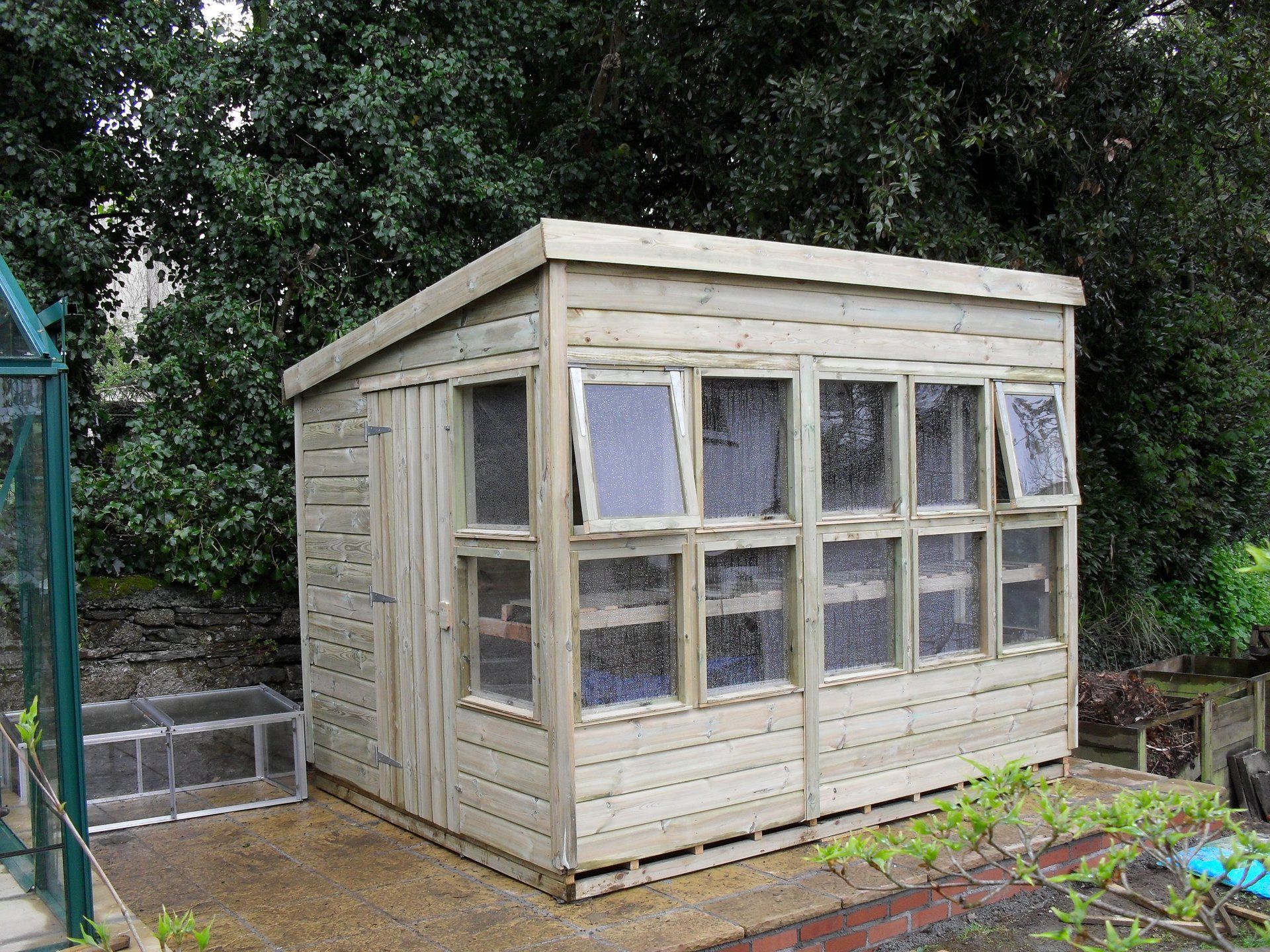 Traditional Potting shed with large windows to the front and sides