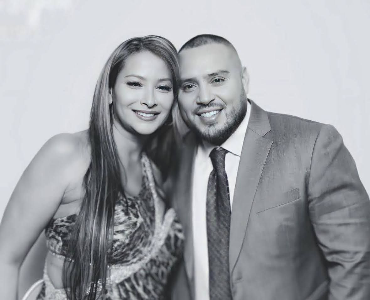 Couple posing in a black and white photo booth rental in Metuchen, NJ