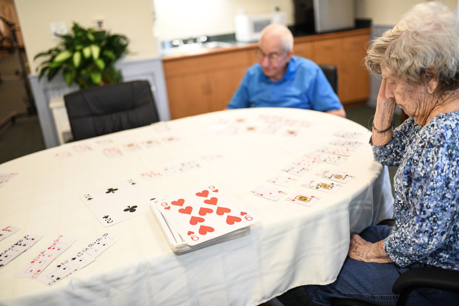 Residents sitting at a table enjoying a puzzle activity at Watson Assisted Living