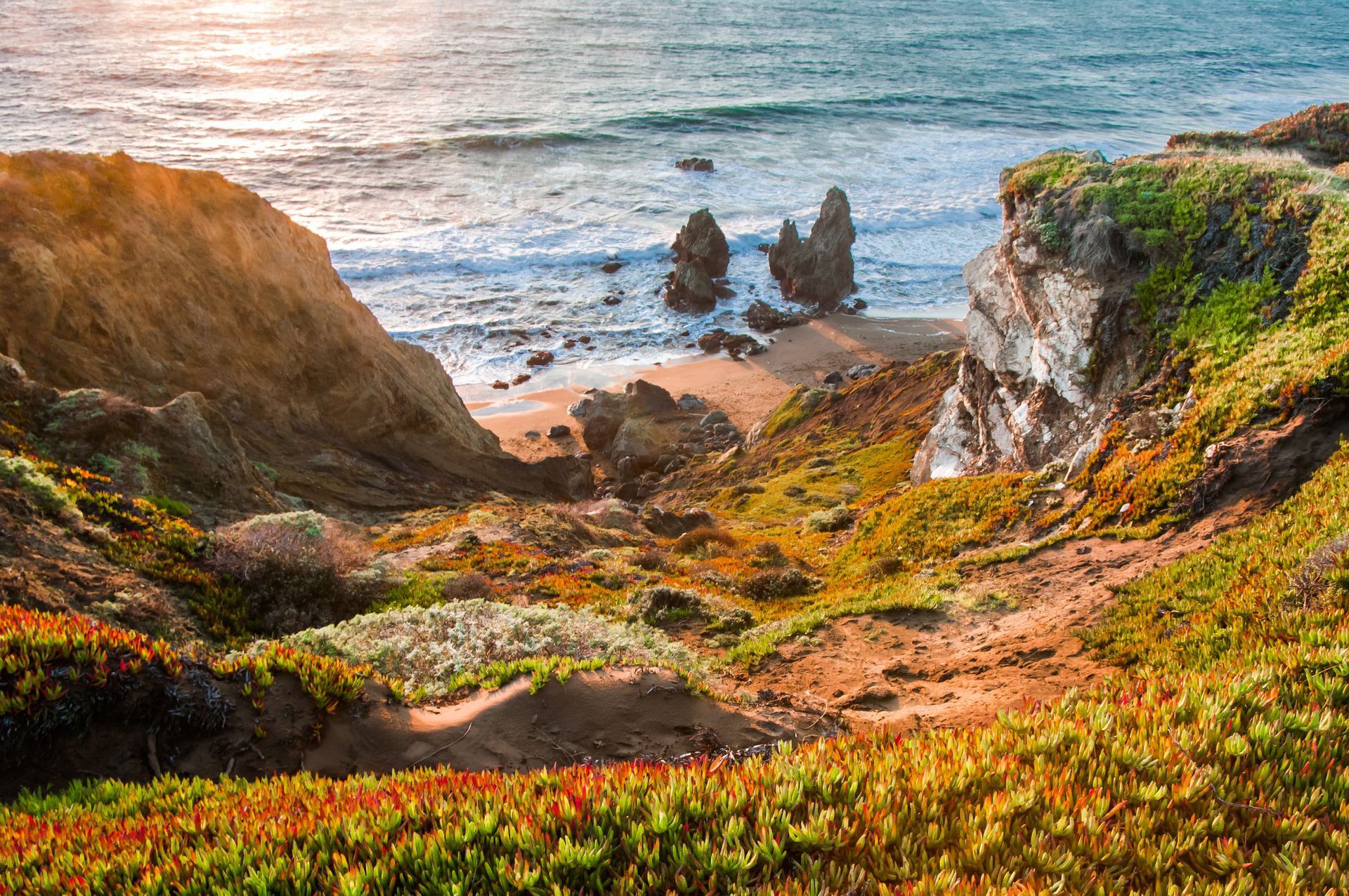 A painting of a cliff overlooking the ocean.