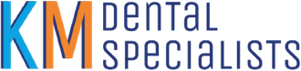 A blue and white logo for km dental specialists