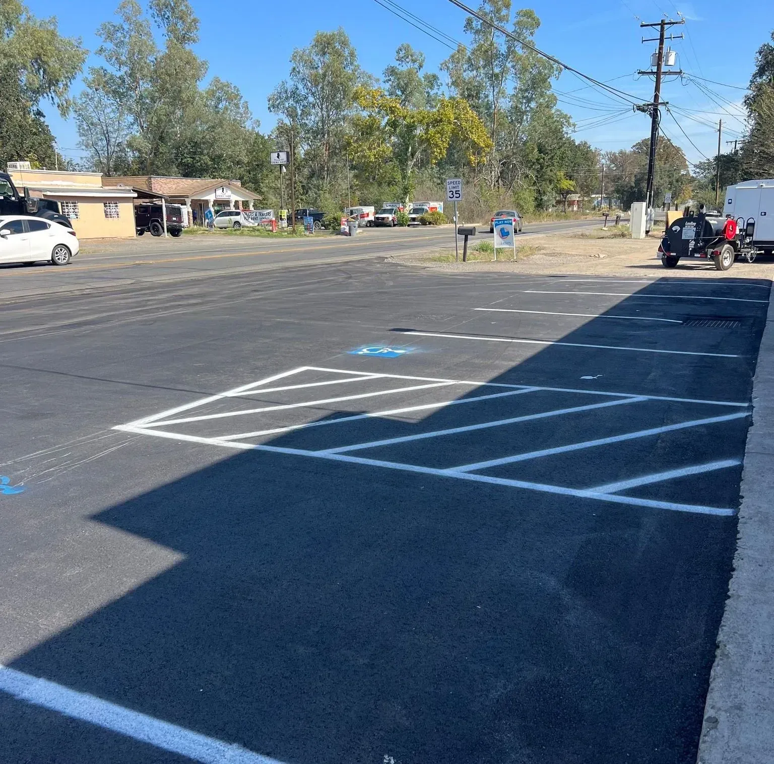 A parking lot with a handicapped parking spot in the middle
