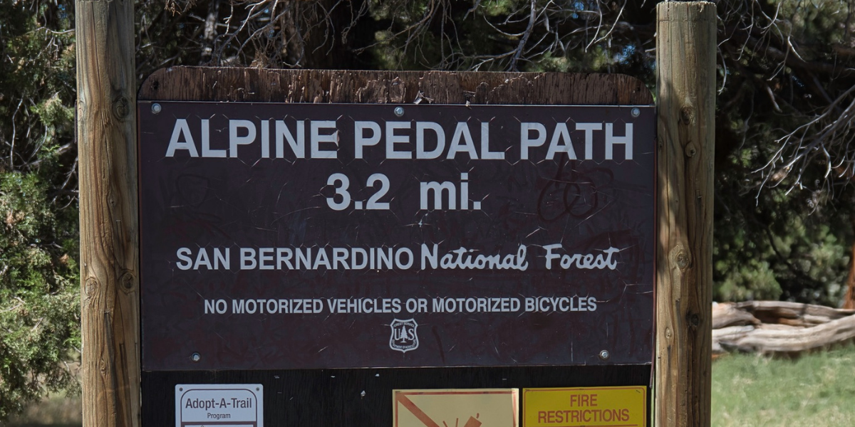 Sign for the Alpine Pedal Path in San Bernardino National Forest: 3.2 mi. No motorized vehicles or motorcycles.