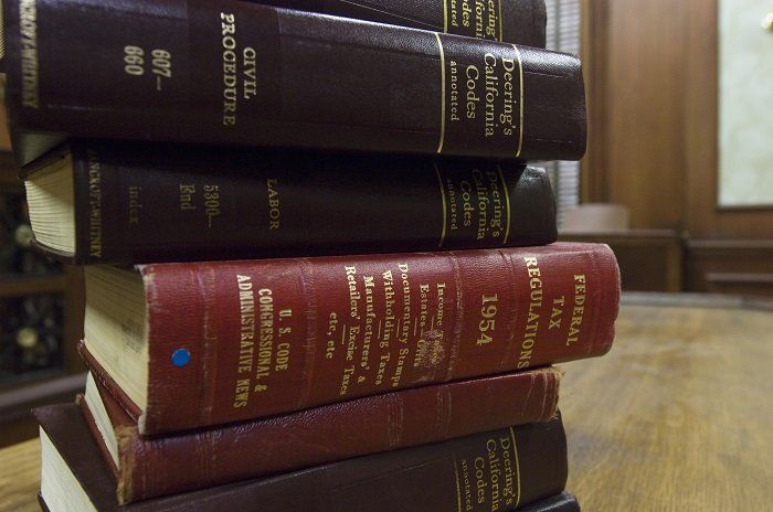 stack of law books in the courtroom
