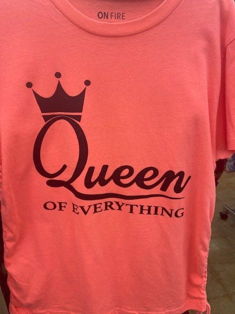 A pink shirt that says queen of everything