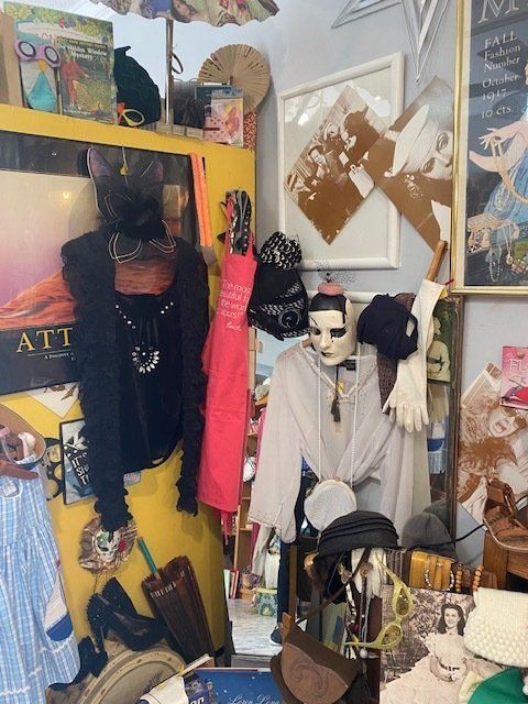 A room filled with clothes and a sign that says att