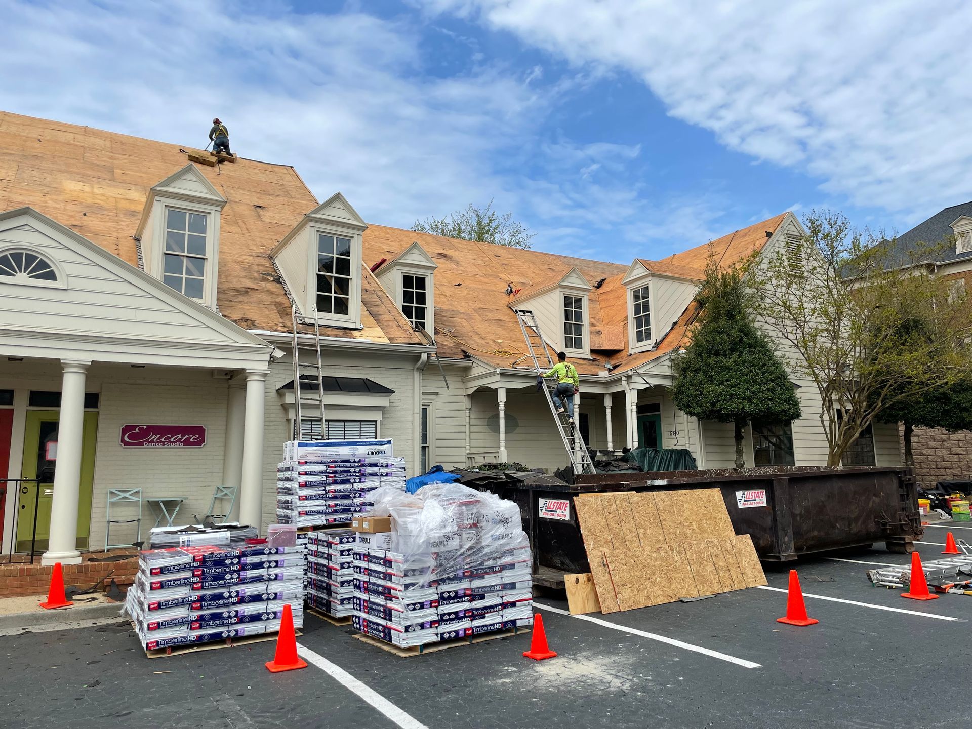 A man is working on the roof of a building.