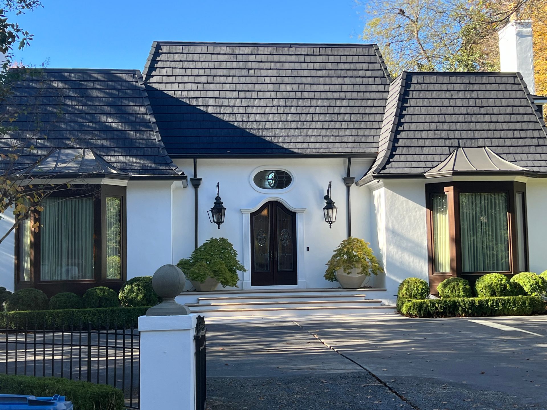 A large white house with a black roof