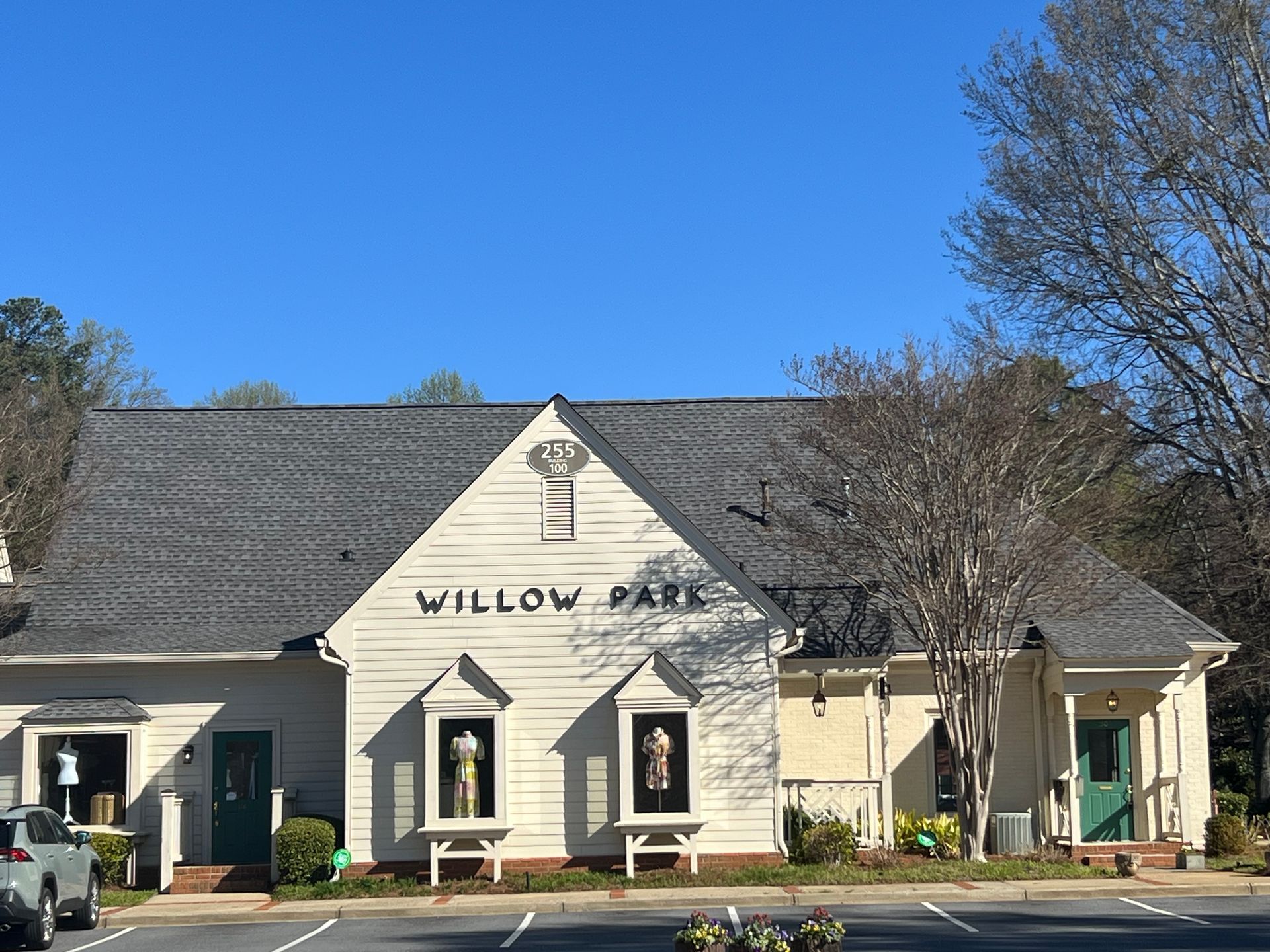 A white building with the word willow park on it