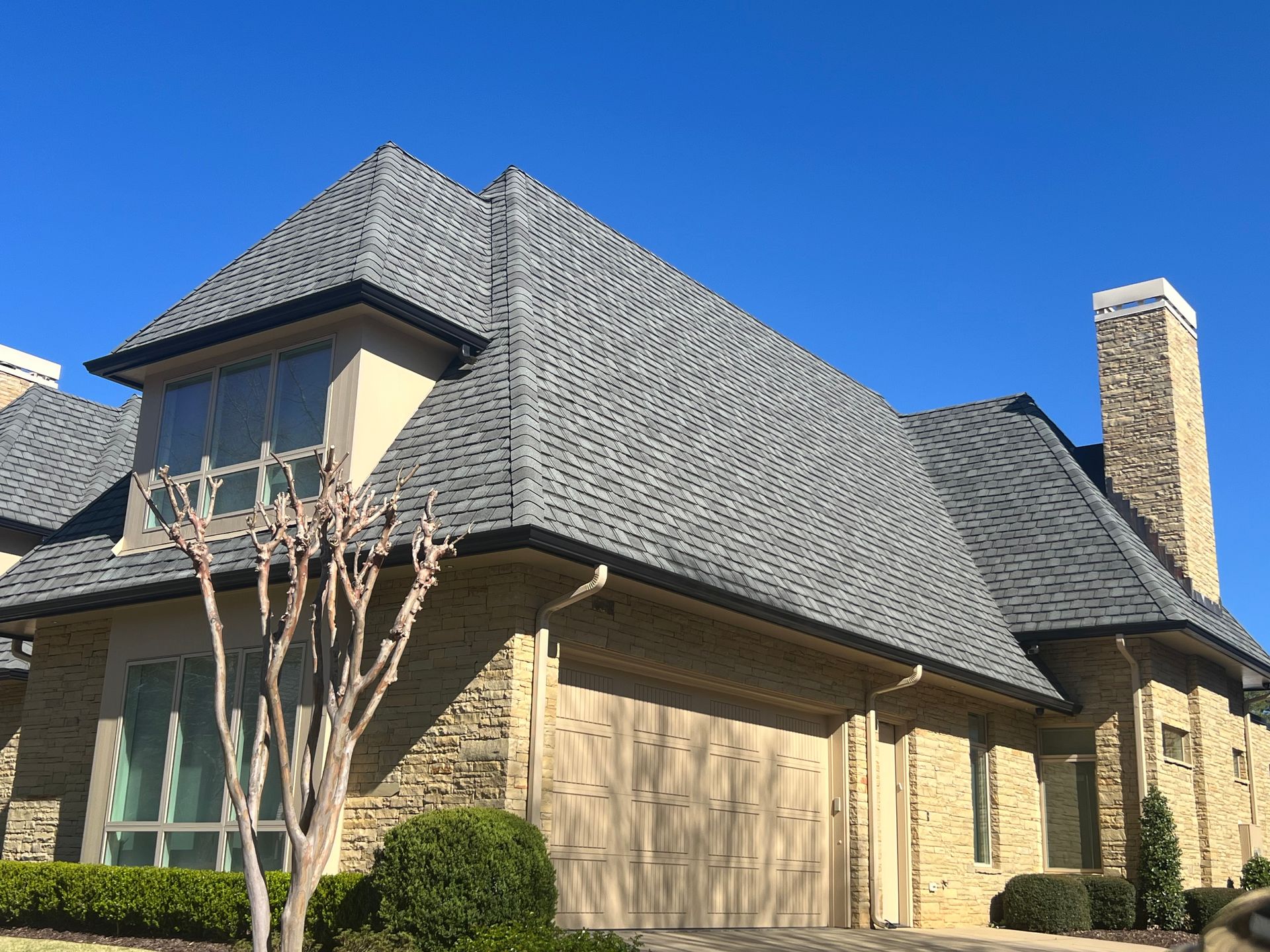 A large house with a large lawn in front of it