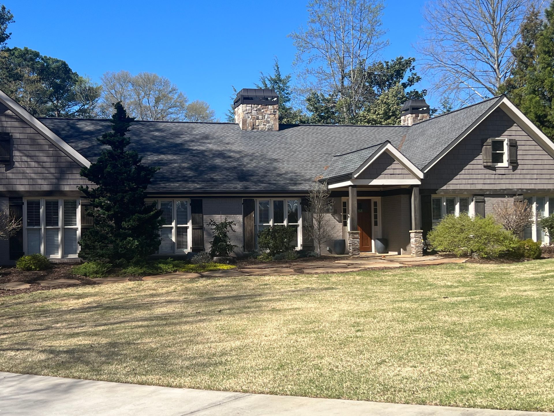 A large house with a large lawn in front of it