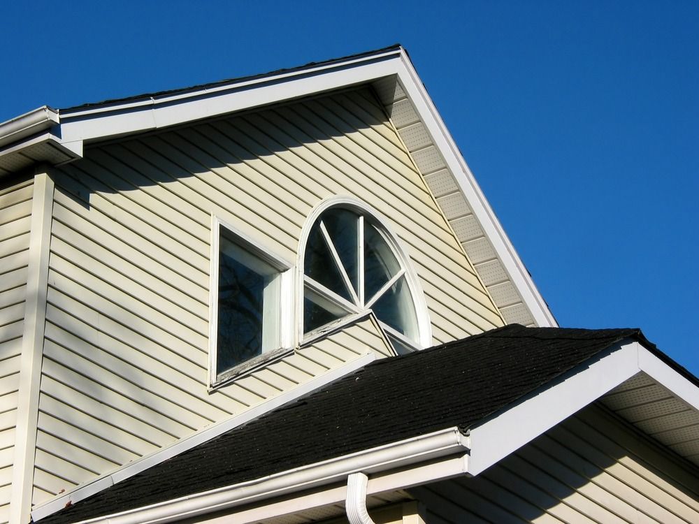 A house with a window on the top of it