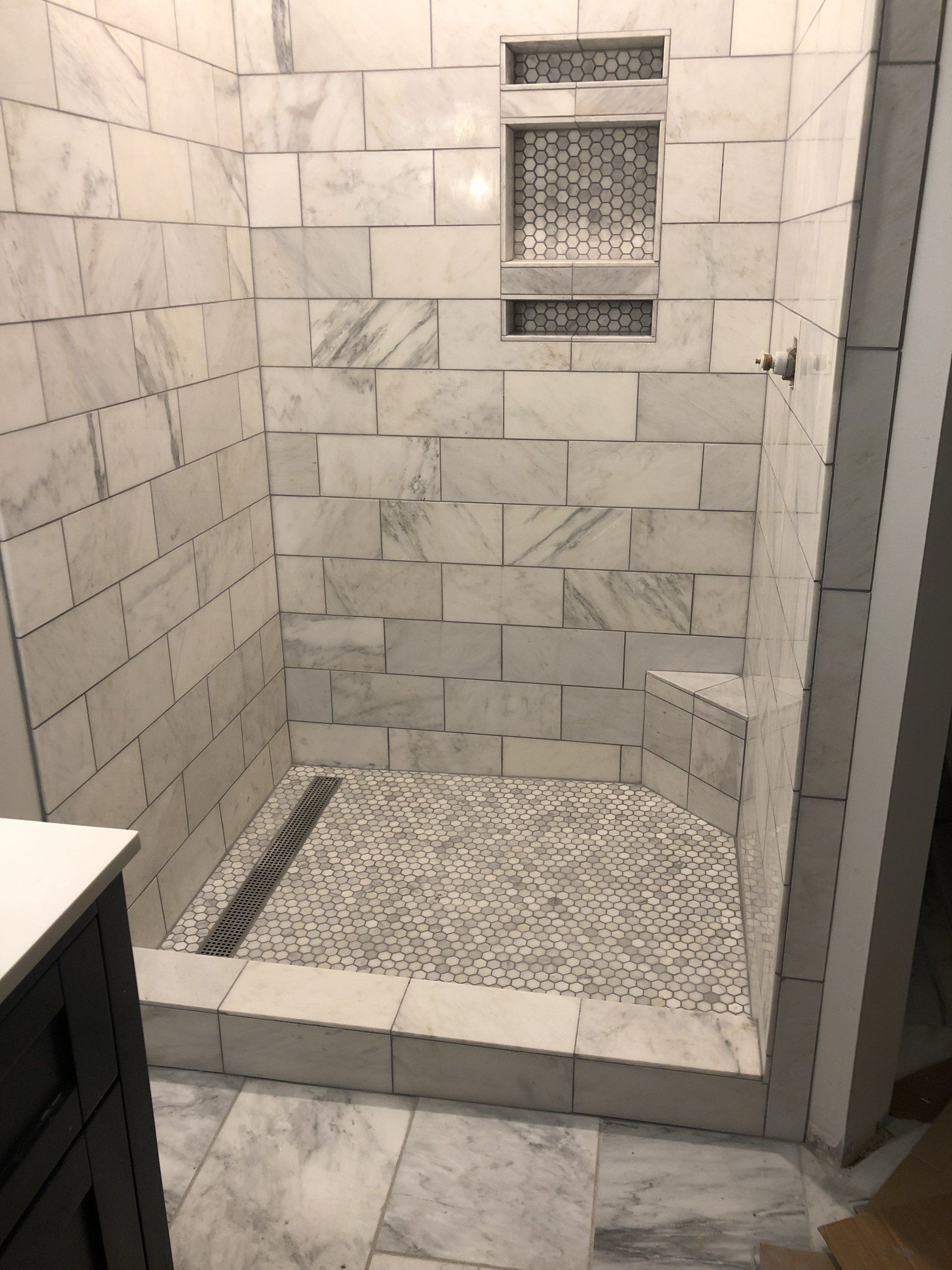 shower tile installation, shampoo shelf