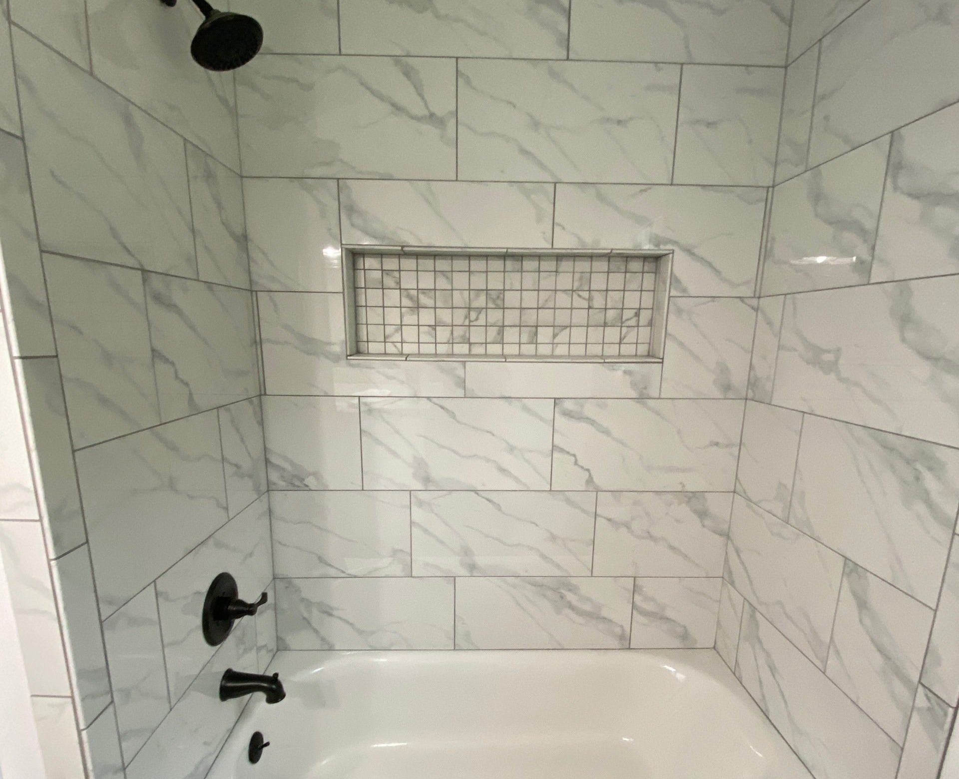 tile bathtub, recessed shampoo shelf 12x24 tile