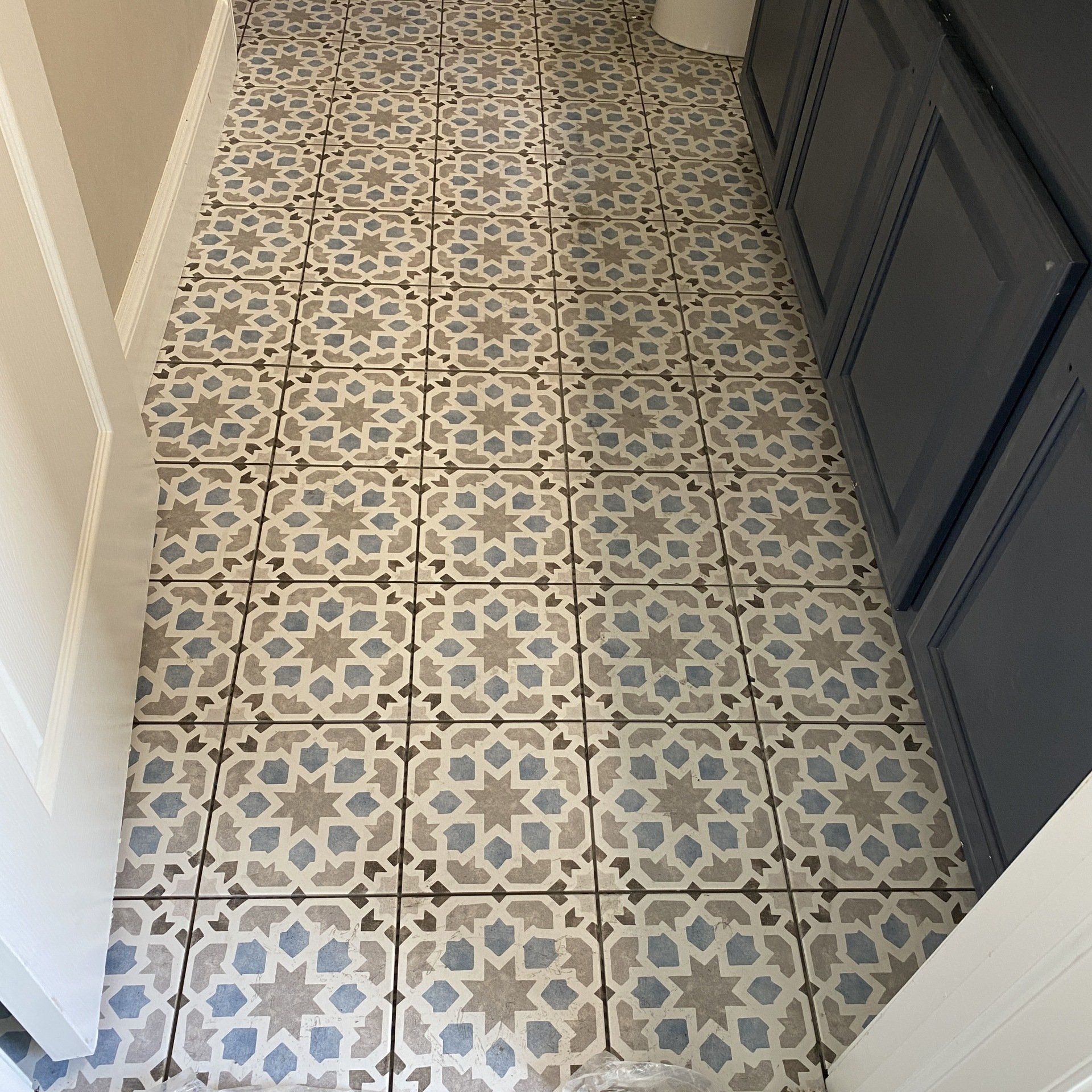 Patterned floor tile installation