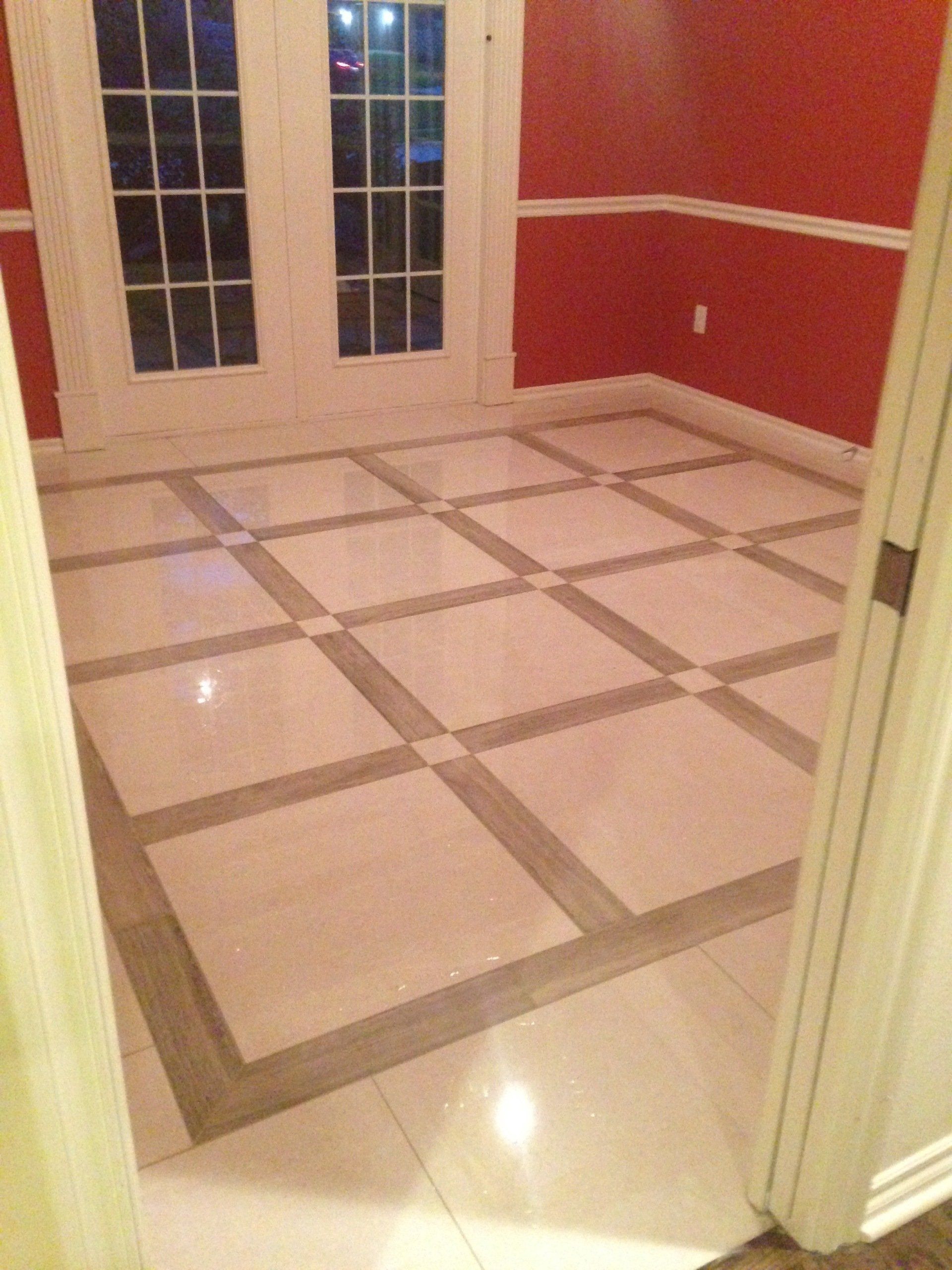 A room with a tiled floor and red walls