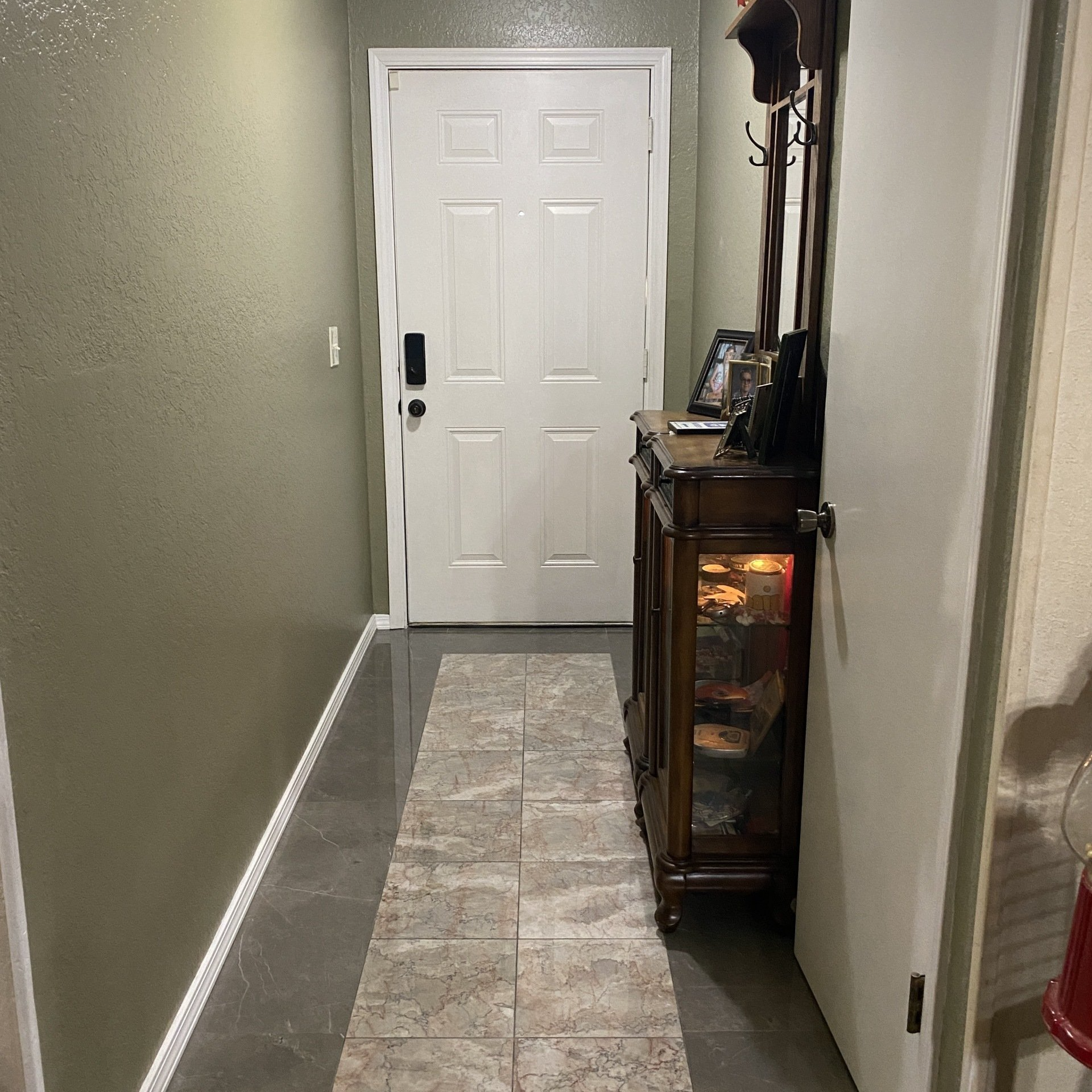 Remodeled kitchen with backsplash tile and tile flooring