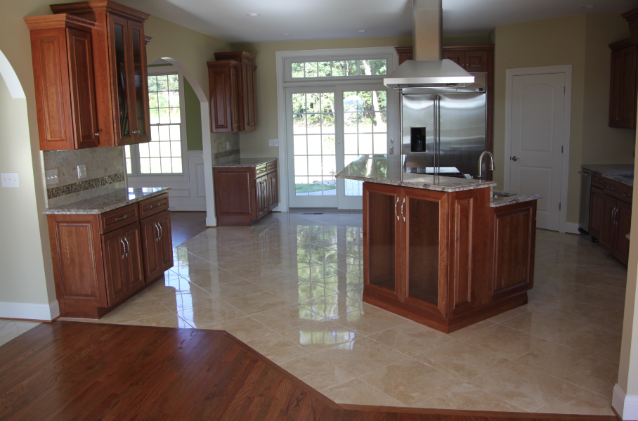 A kitchen with stainless steel appliances and wooden cabinets