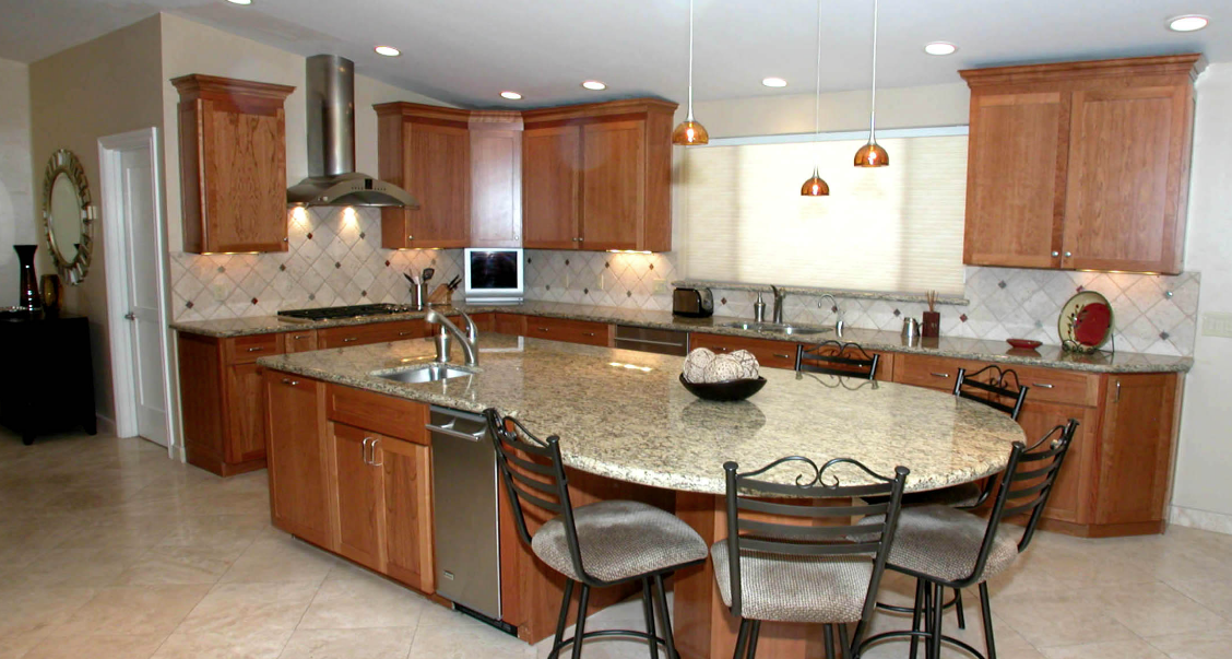 A kitchen with wooden cabinets and granite counter tops