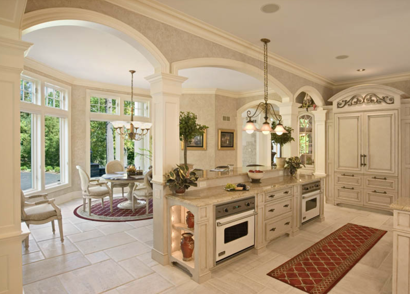 A kitchen with a dining room in the background