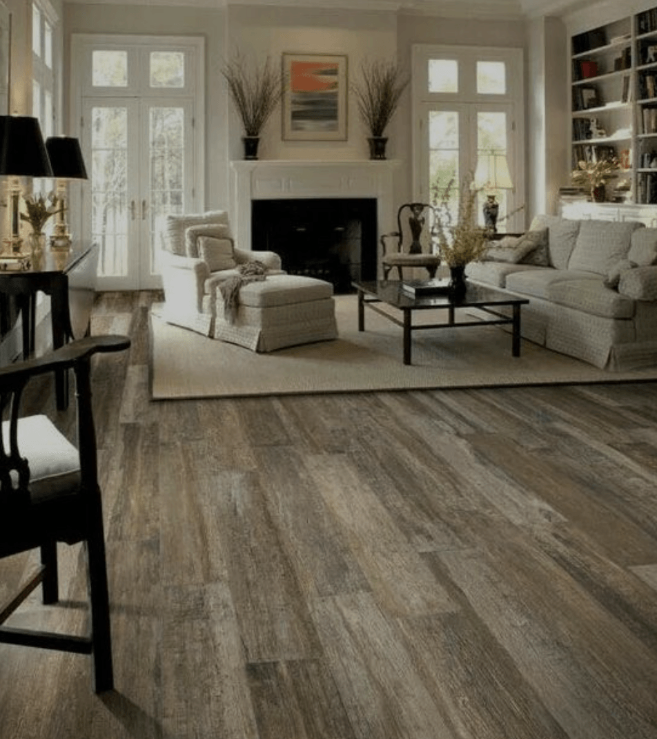 A living room filled with furniture and a fireplace.