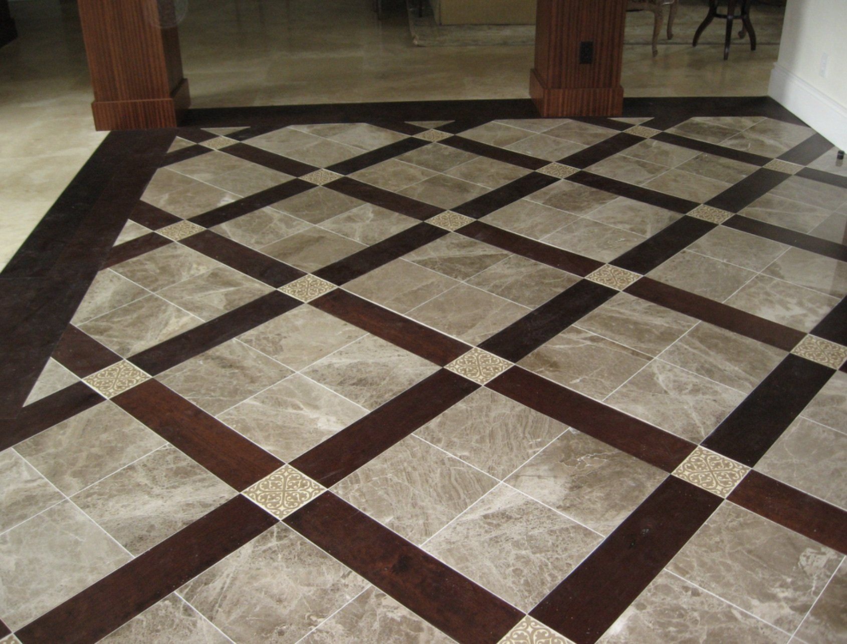 A marble floor with a checkered pattern and a wooden border