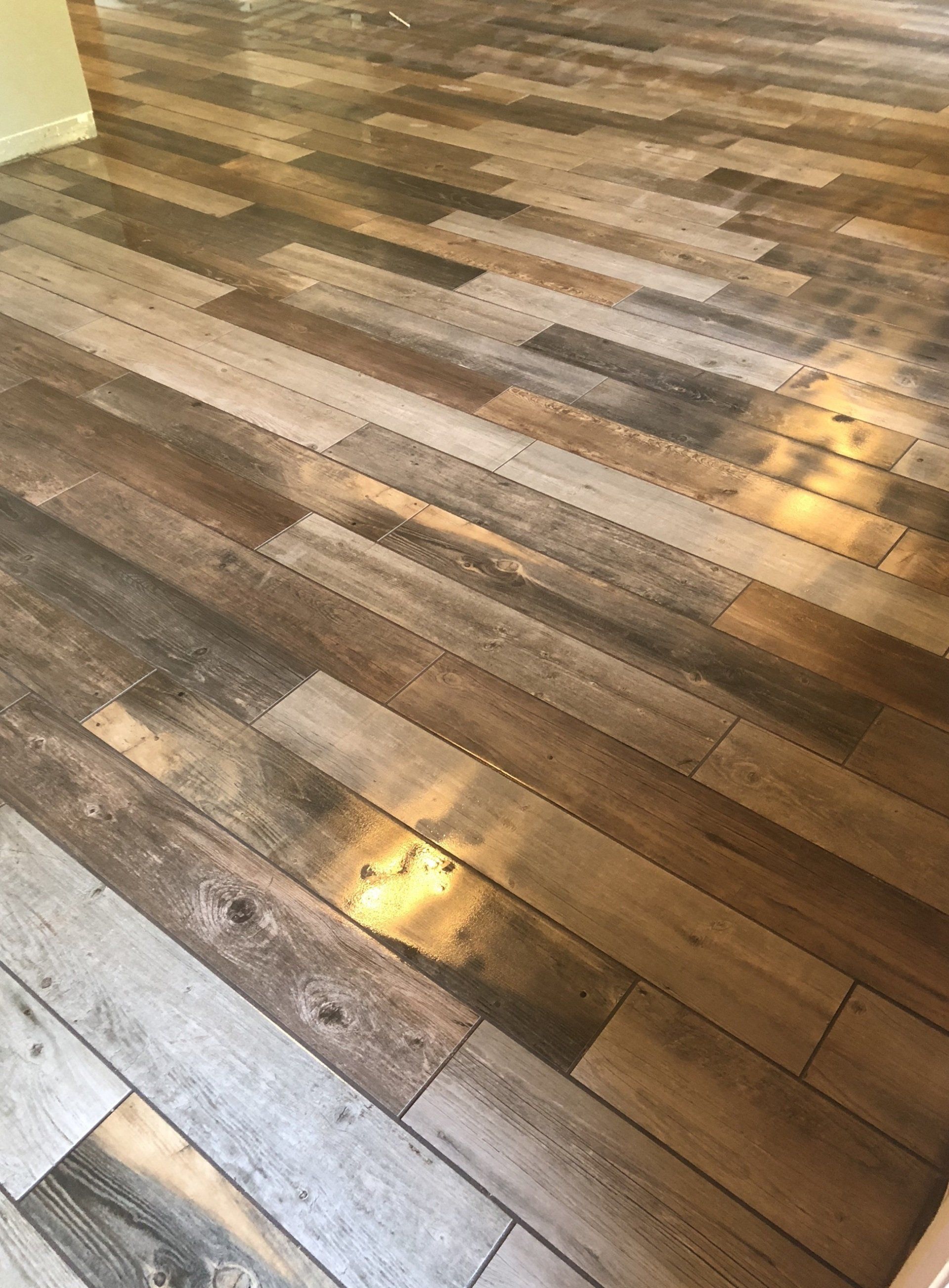 A close up of a wooden floor in a room.