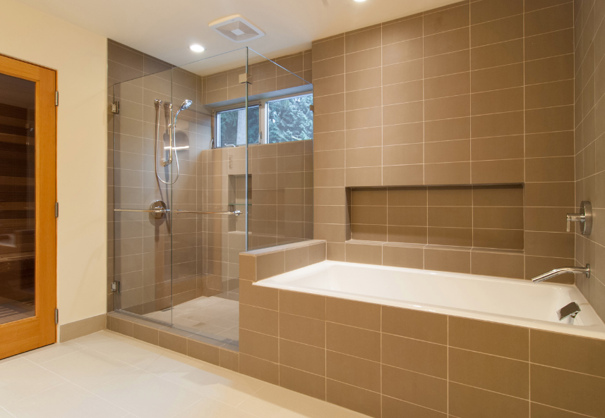 A bathroom with a tub , shower , and sauna.