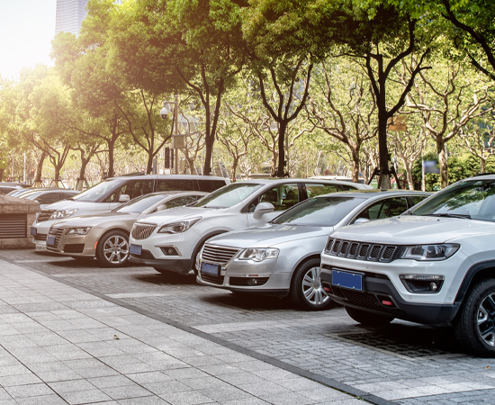 Row of Vehicles Parked Outside