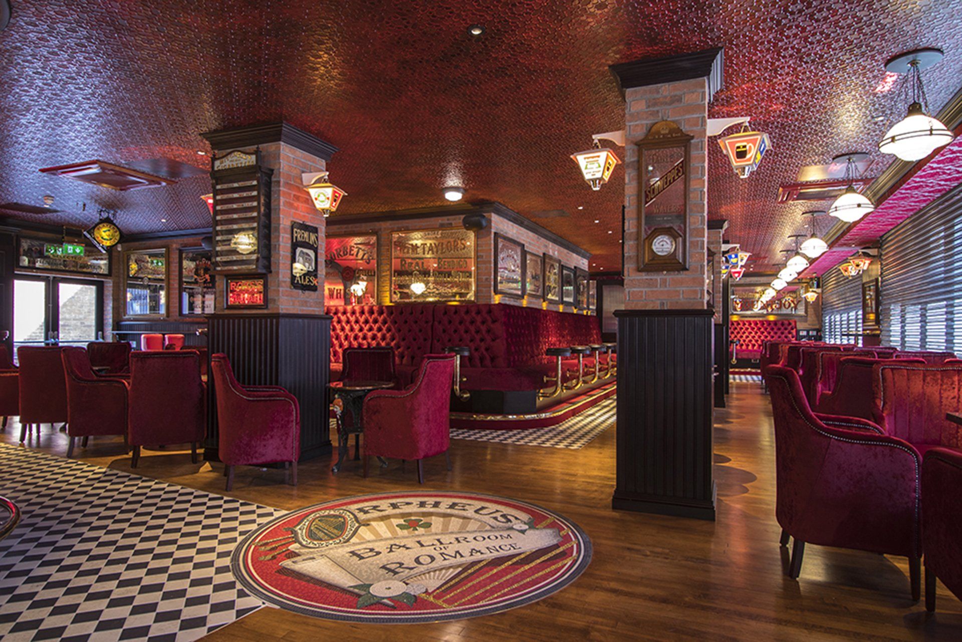 Harp Bar stained red velvet sofas and other internal designs