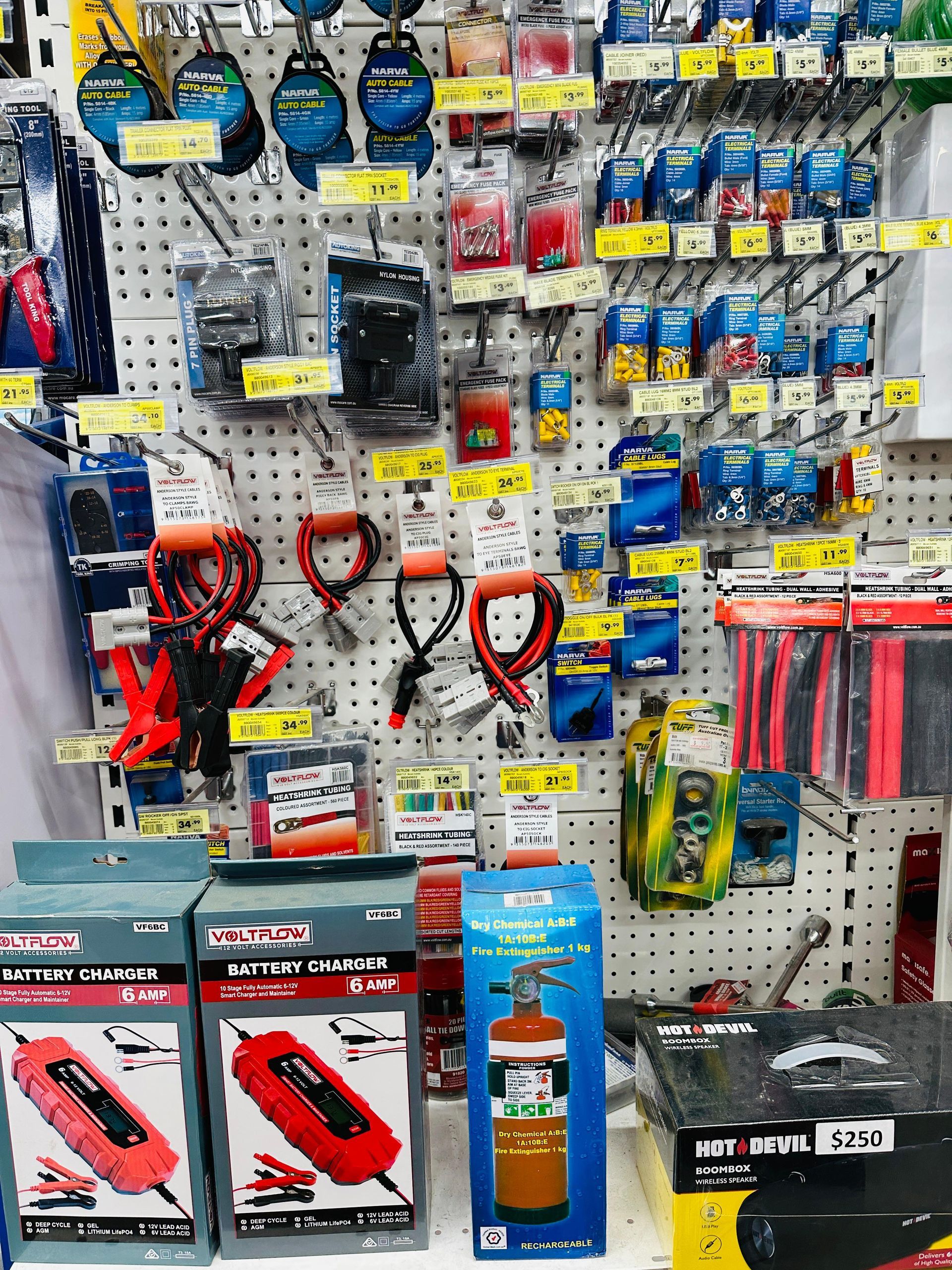 A bunch of car parts are sitting on top of each other on a white surface — Laurieton Warehouse in Laurieton, NSW