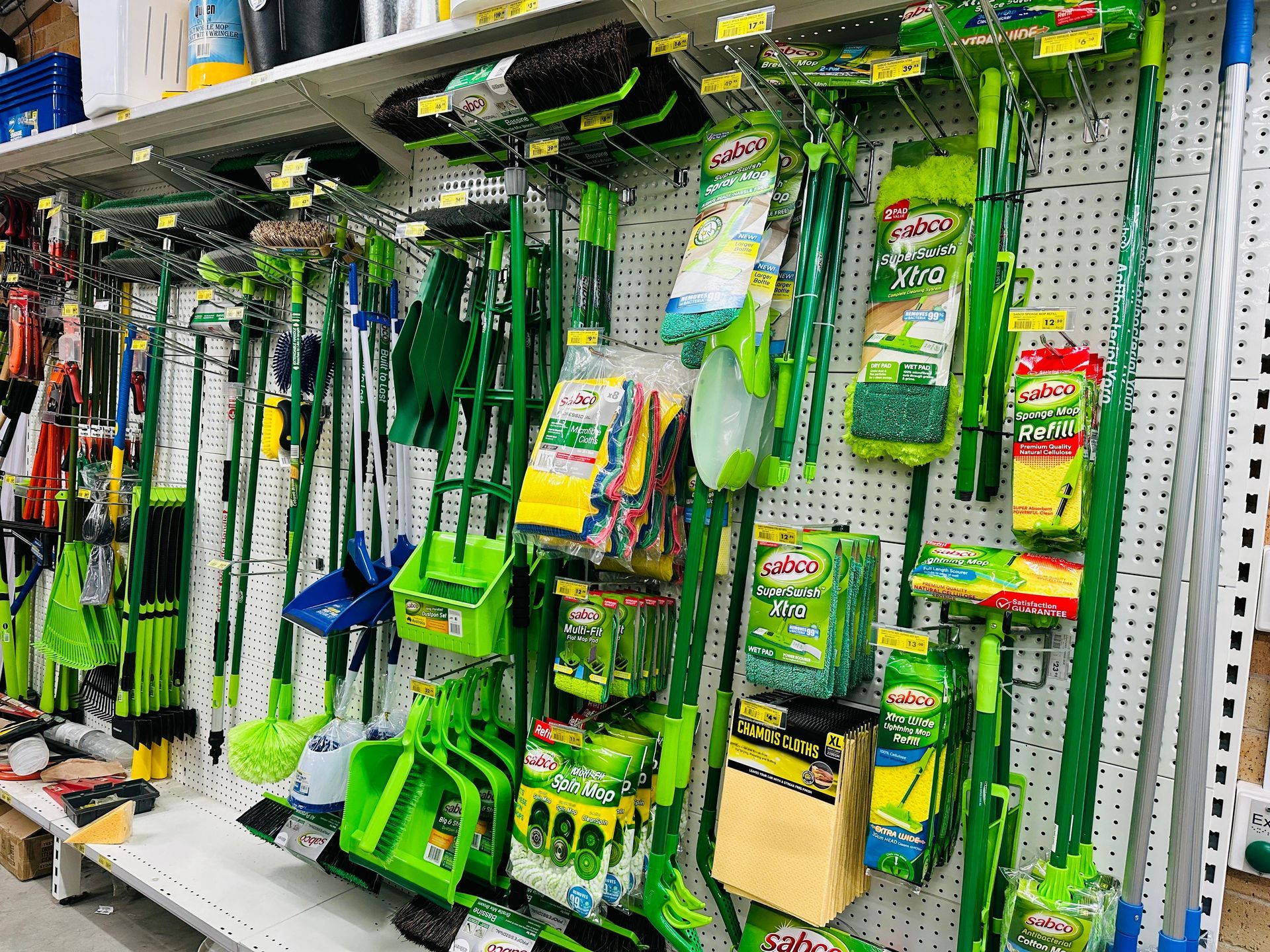 A bunch of cleaning supplies including brushes and sponges — Laurieton Warehouse in Laurieton, NSW