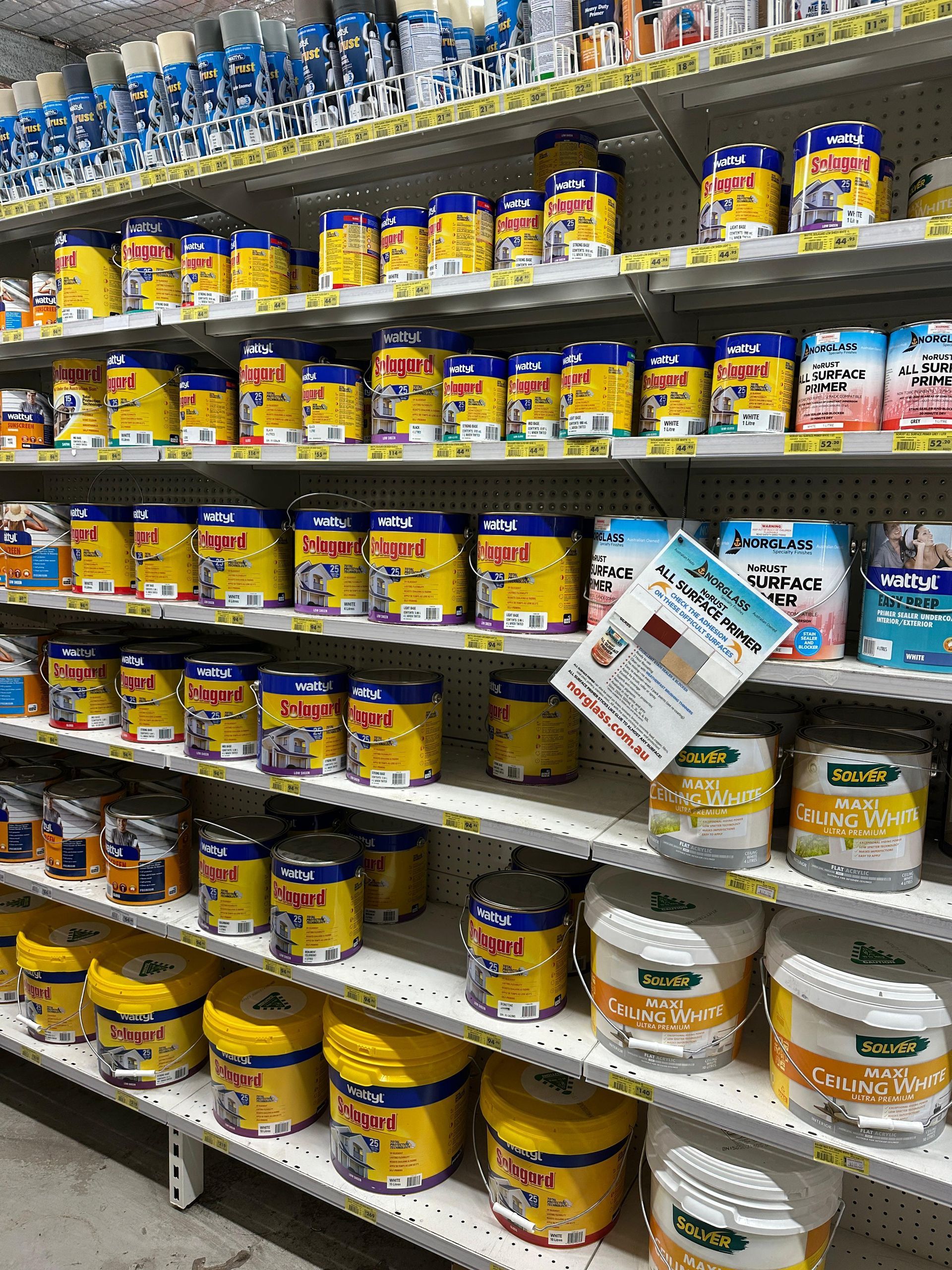 A Store Shelf Filled With Lots Of Cans And Buckets Of Food — Laurieton Warehouse in Laurieton, NSW