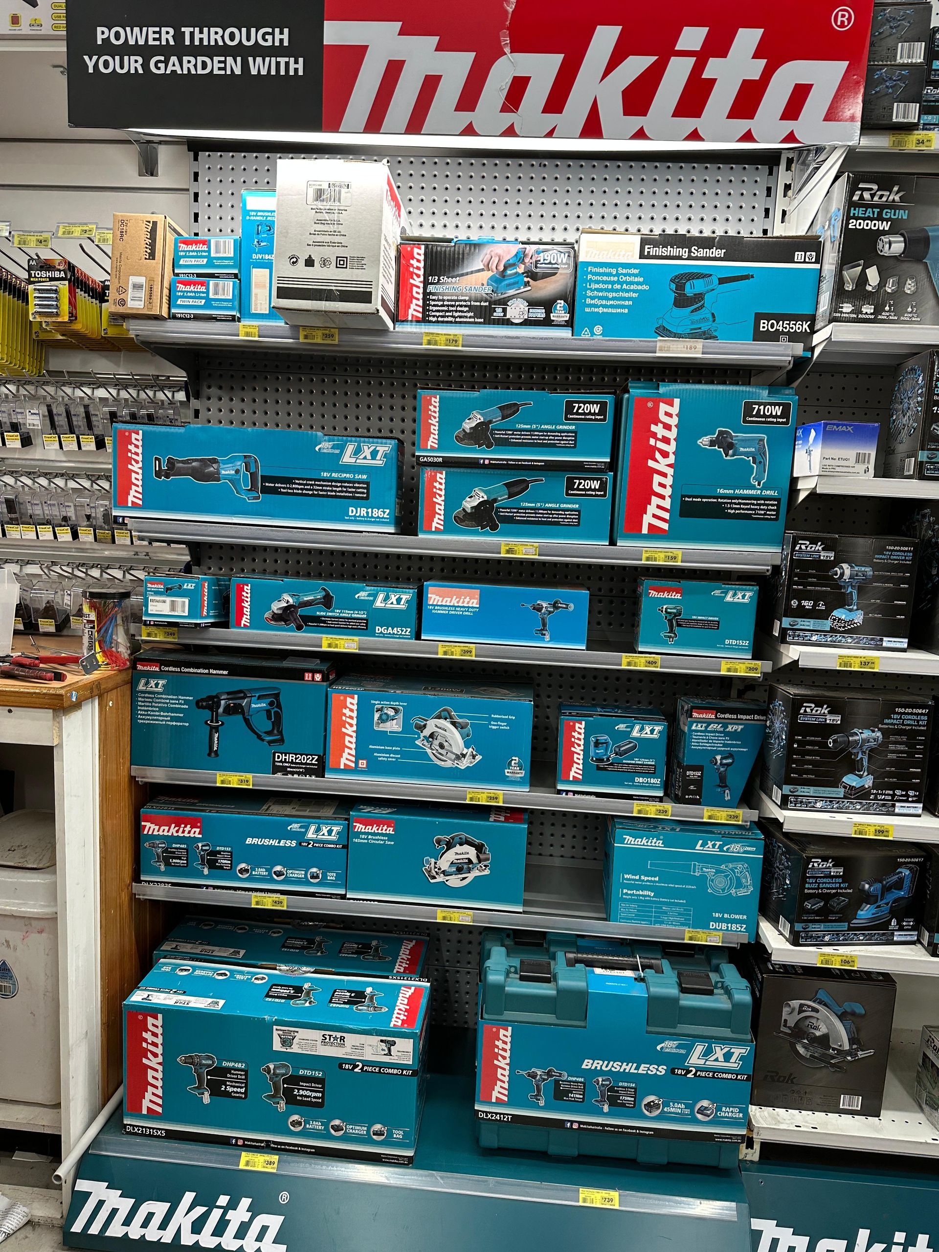A Bunch Of Tools Are Hanging On A Wall In A Store — Laurieton Warehouse in Laurieton, NSW