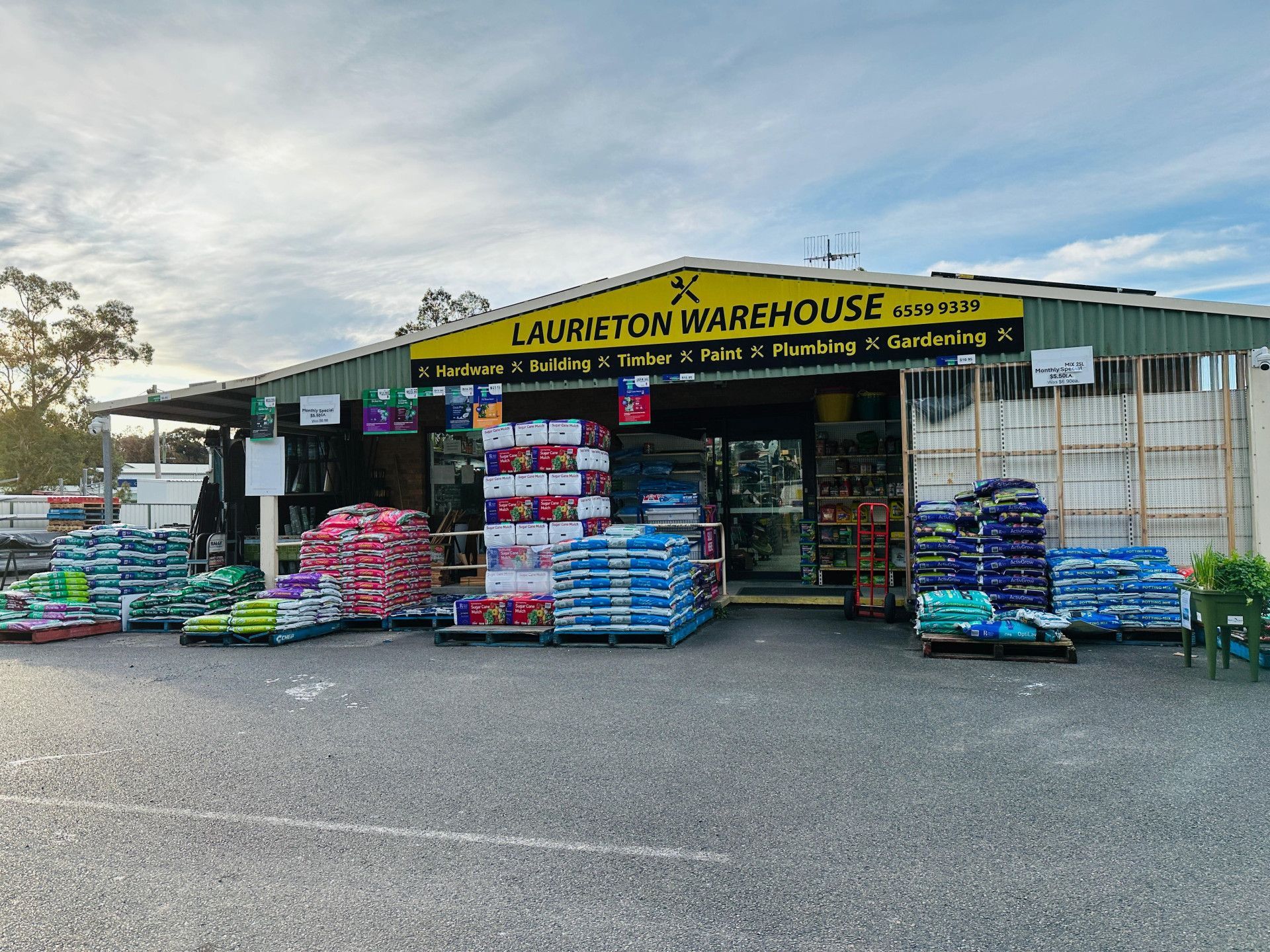 A large warehouse filled with lots of pallets of supplies — Laurieton Warehouse in Laurieton, NSW