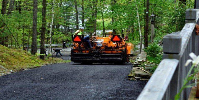 Man Riding a Road Roller — Lunenburg, MA — Miller’s Paving, LLC
