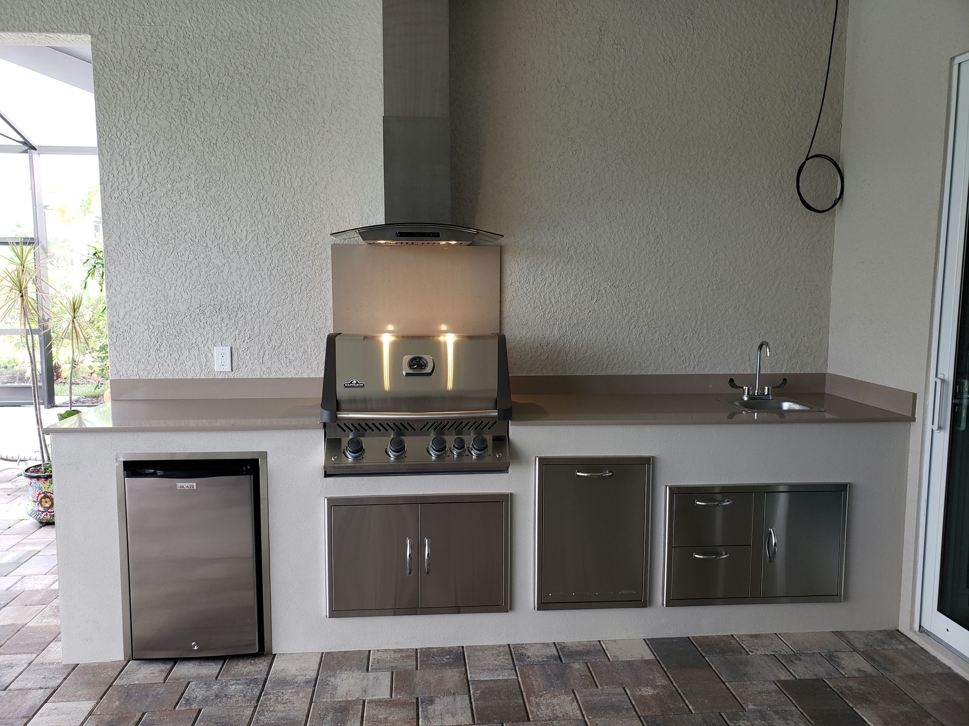 A kitchen with stainless steel appliances and a dishwasher