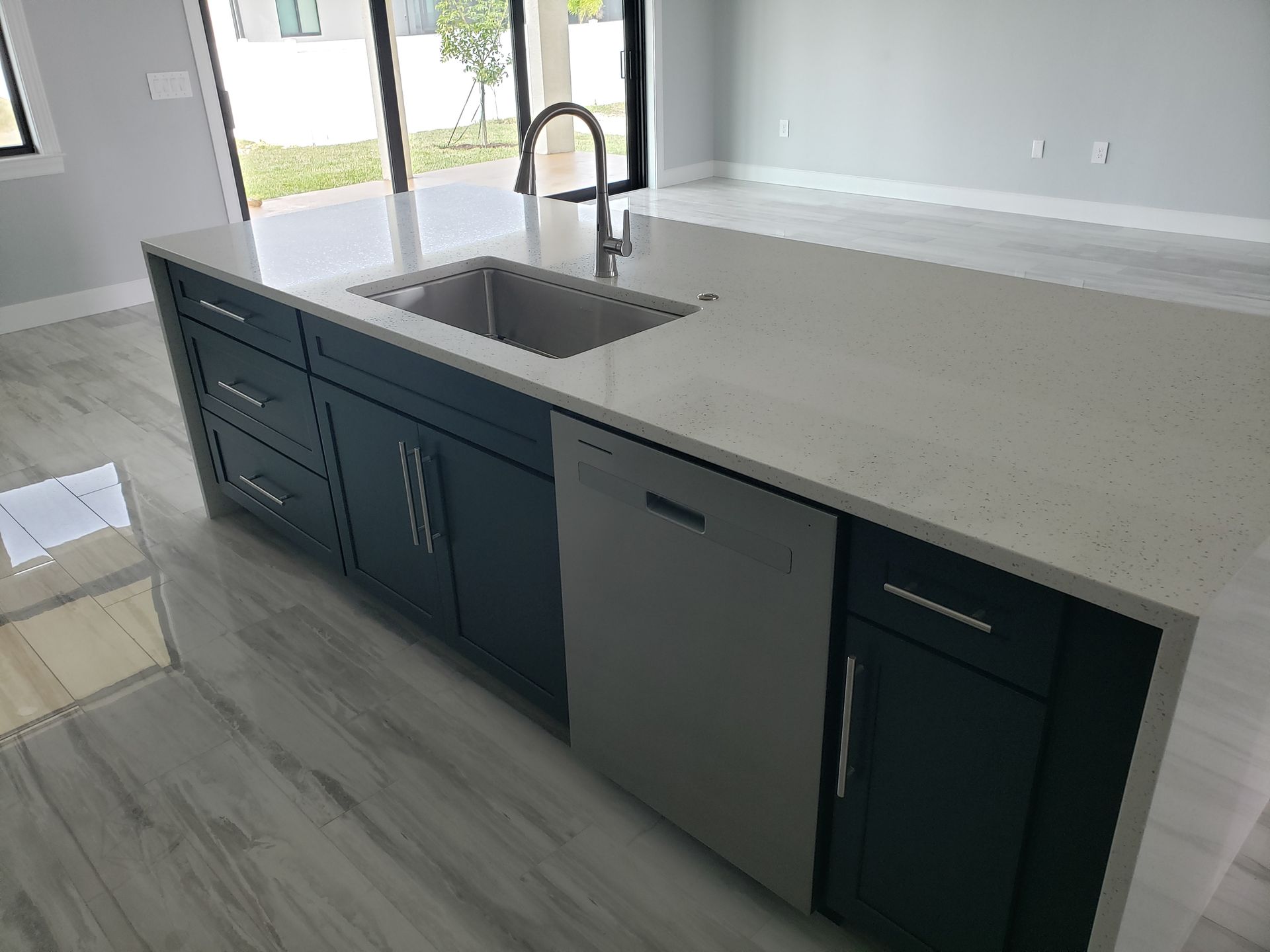 Kitchen island with sink and dishwasher built by Blue Heron Construction Cape Coral