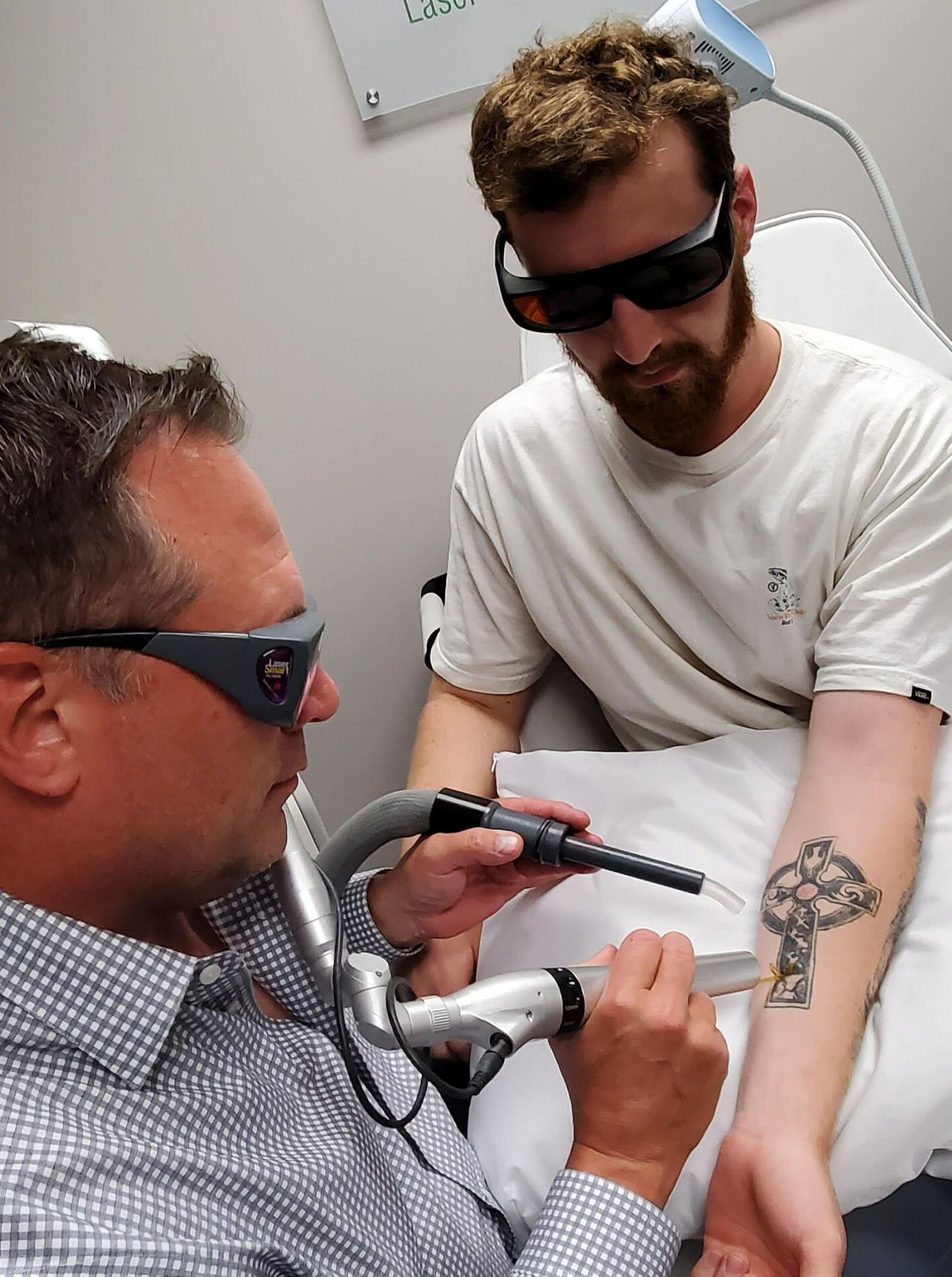 practitioner about to perform tattoo removal