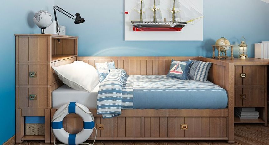 There is a picture of a boat on the wall above the bed.