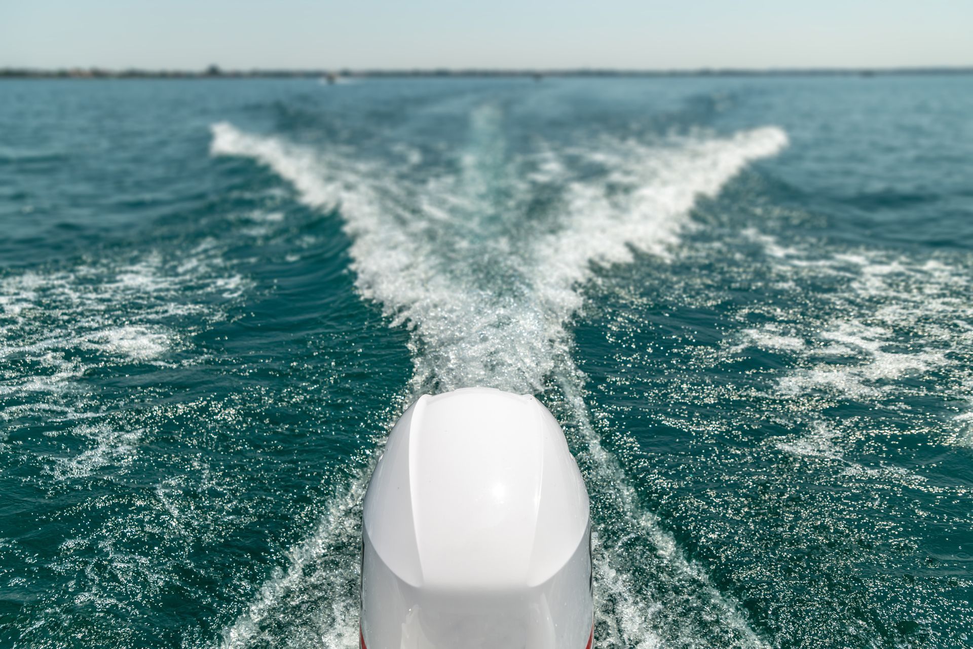 A boat is floating on top of a body of water.