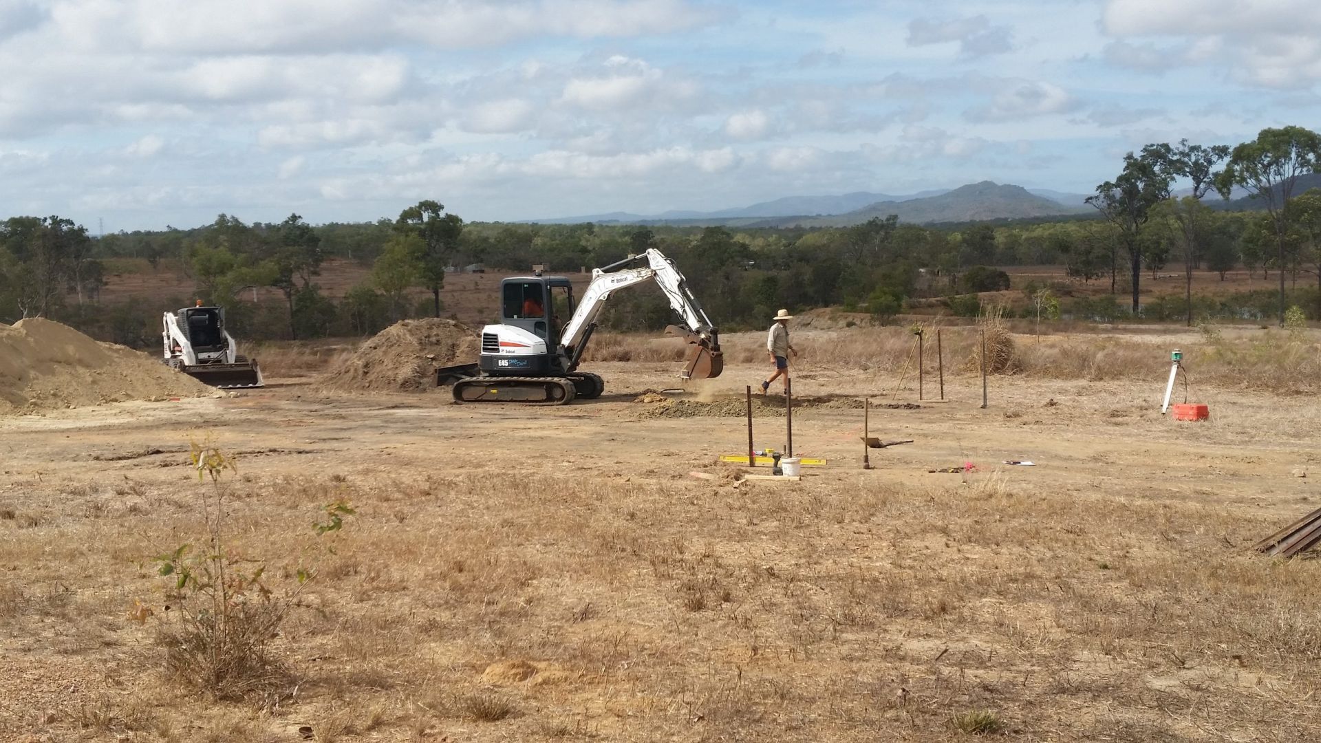 Construction Site with Excavator and Worker — Evans Earthmoving Contractors In Malanda, QLD 