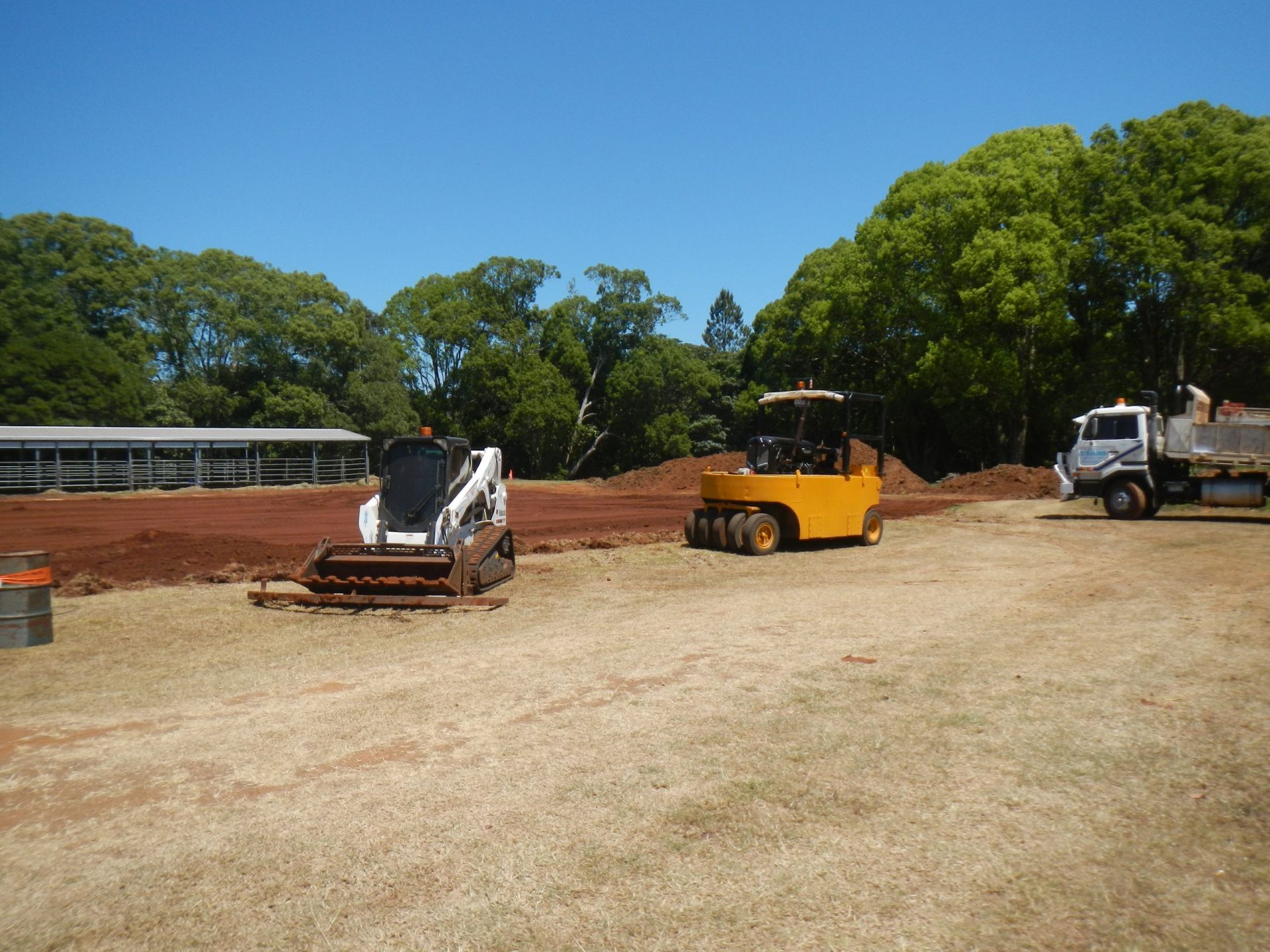 Construction Site With Two Compactors and a Truck on a Dirt Lot — Evans Earthmoving Contractors In Mareeba, QLD