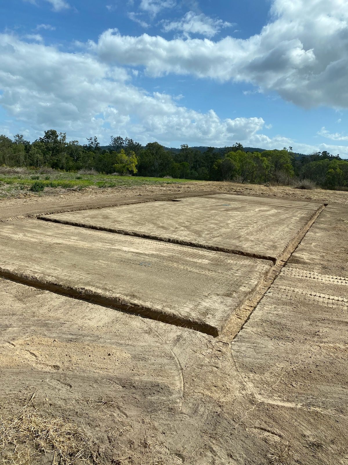 Cleared Dirt Lot With Concrete Foundation Slabs — Evans Earthmoving Contractors In Mareeba, QLD