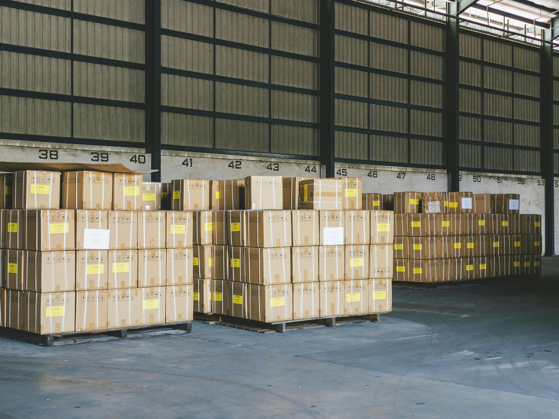 A warehouse filled with lots of boxes and pallets