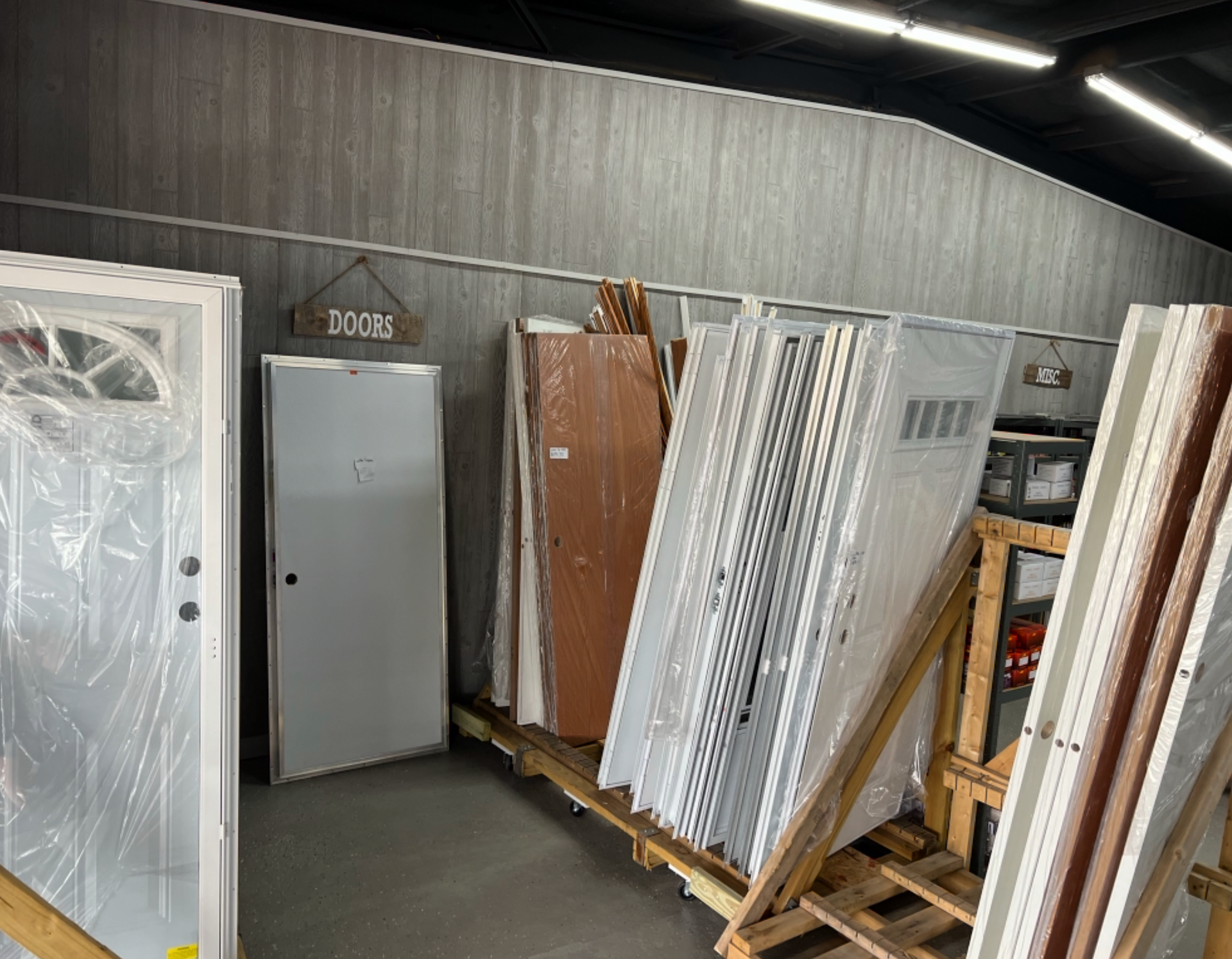 A warehouse filled with lots of different types of doors.