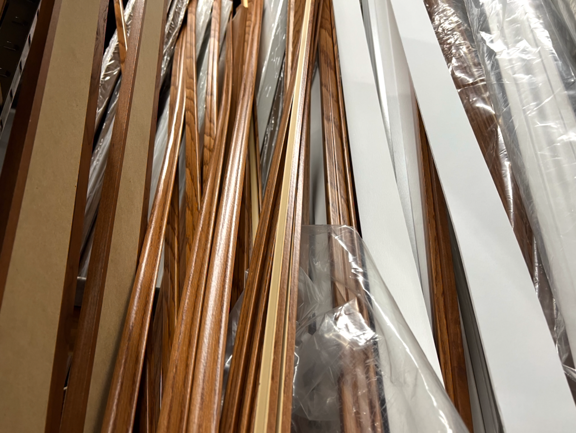A bunch of wooden sticks are wrapped in plastic